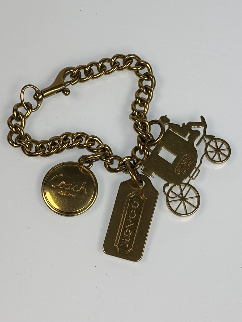 Coach Gold-Tone Carriage Bag Charm Link Bracelet. Medallion, Tag Stagecoach
